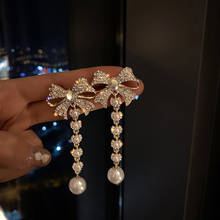 Pendientes largos con diamantes de imitación para mujer, aretes largos con diseño de borlas, perlas, cristales dorados, accesorios de boda 2024 - compra barato