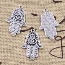 Colgantes de Color plata antigua para manualidades, joyería tibetana de 28x18mm con diseño de ojo de la muerte, mano de Fátima, palma de la Hamsa, 12 Uds. 2024 - compra barato