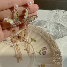 Pendientes largos de perlas para mujer, aretes colgantes con borla de mariposa, aguja de Color plateado, accesorios Coreanos 2024 - compra barato