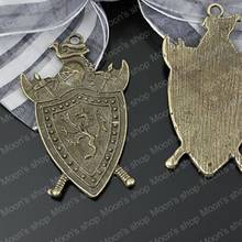 Hacha de escudo de bronce antiguo de 43x28mm, insignia de aleación plana, colgantes, accesorios de bricolaje, 10 piezas (JM1214) 2024 - compra barato