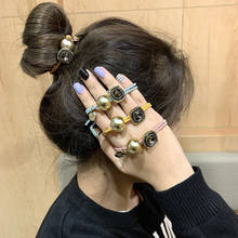 Cuerda para el pelo para mujer, accesorio de moda coreana, retro, con perlas, para la cabeza, banda de goma para estudiantes, Anillo para el pelo, pulsera de doble propósito 2024 - compra barato