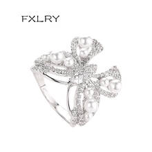 FXLRY Hot Sale Luxurious Shiny Micro-Inlaid White Color Zircon Ring Exaggerated Big Bow Pearl Ring For Women Jewelry 2024 - buy cheap