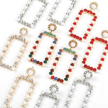 Pendientes colgantes con perlas de imitación de Metal para mujer, aretes creativos populares, accesorios de joyería para banquete 2024 - compra barato