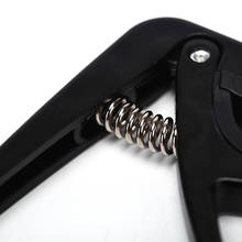 Ukelele Capo de Color negro para una sola mano, cambio rápido, piezas y accesorios de guitarra de acero y plástico, 1 ud. 2024 - compra barato
