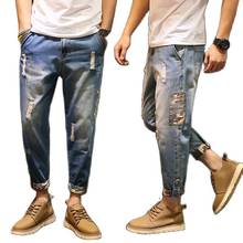 Atacado 2020 marca de moda masculina primavera rasgado buraco jeans camuflagem lado solto tamanho grande 28-42 coreano harem calças 2024 - compre barato