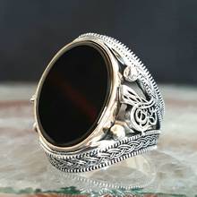 925 пробы Серебряное мужское кольцо из пуфика и оникса 2024 - купить недорого